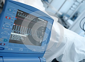 Modern ICU monitor in clinical ward next to the bed of the patient