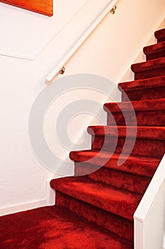 Modern Indoor Marble Staircase With Red Carpet.