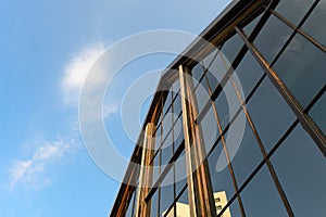 Modern industrial building with gable shape with glass reflection