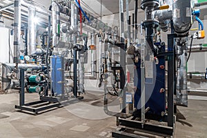 Modern industrial building with pipes, heat exchangers and valves