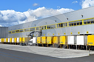 Modern industrial buildings in transport - loading of goods on trucks of a forwarding agency for export