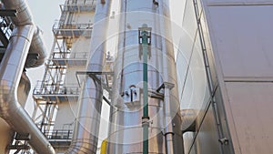 Modern industrial exterior. Pipeline in a modern factory. Factory storage tanks