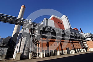 Modern industrial factory against blue sky