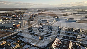 Modern industrial factory near residential area in european city, aerial view