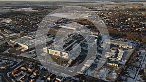 Modern industrial factory near residential area in european city, aerial view