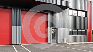 Modern industrial unit with two red roller doors