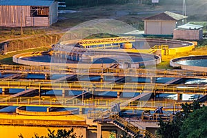 Modern industrial wastewater treatment plant at night. Aerial view of sewage purification tanks