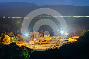 Modern industrial wastewater treatment plant at night in Mountainous region. Aerial view