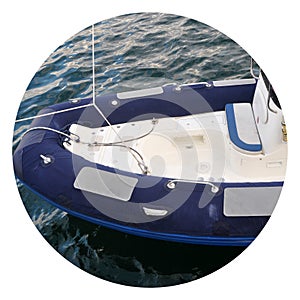 Modern inflatable boat with engine in the sea near shore