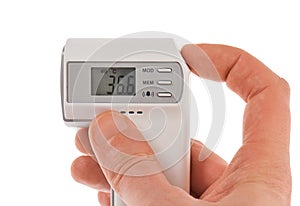 Modern infra-red digital thermometer with hand photo