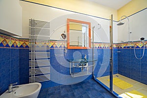 Modern interior of bathroom in luxury apartment. Blue and yellow.