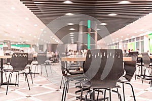 Modern interior of cafeteria or canteen with chairs and tables