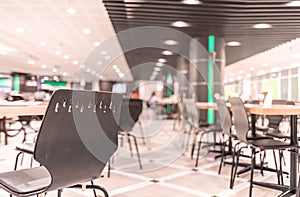 Modern interior of cafeteria or canteen with chairs and tables