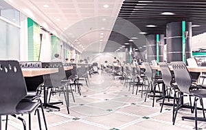 Modern interior of cafeteria or canteen with chairs and tables