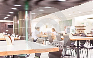 Modern interior of cafeteria or canteen with chairs and tables