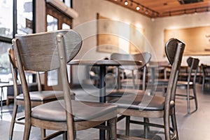 Modern interior of coffee shop decorate with wooden furniture