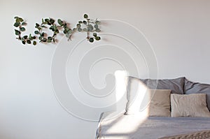 Modern interior design concept. Minimal Nordic Scandinavian style living room sofa with pillows