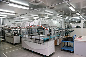 Modern interior electronics components production, parts warehouses and models of new equipment