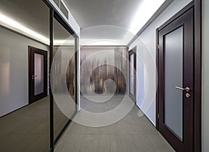 Modern interior of entrance hall in house. Mirror sliding door wardrobe.