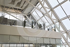 Modern interior of an office building.The interior of a modern multi-storey business center with large windows and many