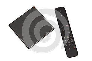 Modern Iptv box and black remote controller multimedia device for viewing television via Internet multimedia player and control
