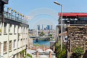 Modern Istanbul city with skyscrapers is seen on the background of the old city. Contrast between modern and ancient and old and