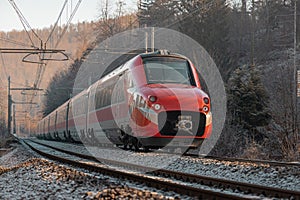 Modern italian electric high speed train on test drive in Slovenia, between station of Verd and Sezana. Upcoming train service photo