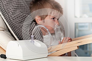 Modern jet nebulizer or atomizer for making inhalation, respiratory procedure by pneumonia or cough for child in home. Treatment