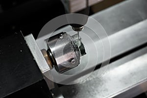 Modern jewelry technology. Cnc machine cuts out green wax ring. Production of rings. Craft jewelery making.