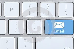 Modern keyboard with envelope sign on button, top view. Sending email letters