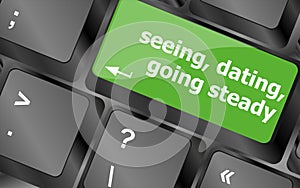 Modern keyboard with seeing, dating, going, steady text symbols