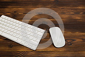 Modern  keyboard on the wooden table with mouse  in the office