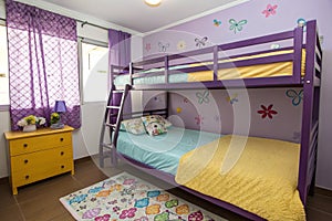 Double bunk bed in kids bedroom with purple decor