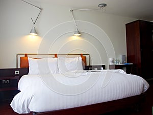 Modern king-size bed with lamps