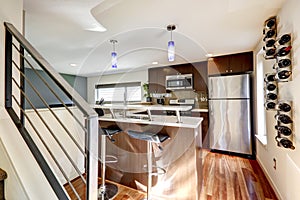 Modern kitchen area with wine racks