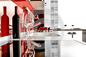 Modern kitchen with bottle and goblets