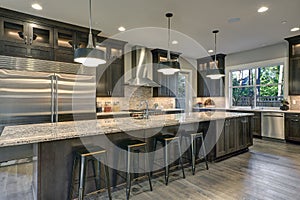 Modern kitchen with brown kitchen cabinets photo