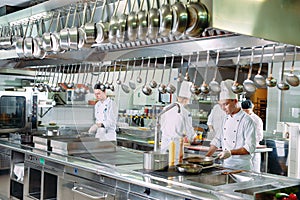 Modern kitchen. The chefs prepare meals in the restaurant`s kitchen