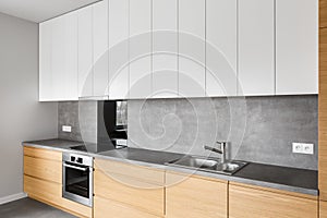 Modern kitchen furniture with induction photo