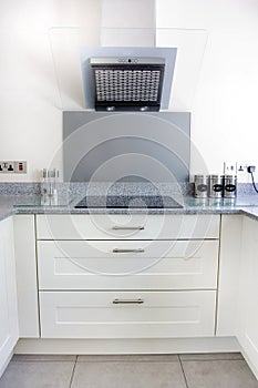 Modern kitchen hob and extractor fan photo