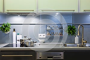 Modern kitchen at home with kitchenware