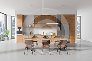 Modern kitchen interior with dining area, wooden finishes