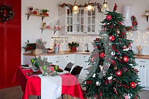 Modern Kitchen Interior with Island, Sink, Cabinets in New Luxury Home Decorated in Christmas Style.