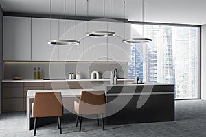 Modern kitchen interior with table and seats, shelves and panoramic window