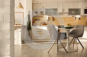 Modern kitchen interior with white furniture. Space for text
