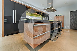 Modern kitchen island with integrated drawers