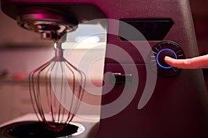 The Modern Kitchen Mixer Control Panel is currently in use for preparation and cooking activities