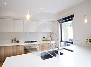 Modern kitchen with pendant lighting and sunken sink