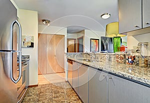 Modern kitchen room with blue cabinets and granite counter top