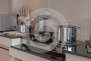 modern kitchen room with pot and pan